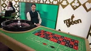 Live dealer studio at juragan77 login showing multiple camera angles and professional blackjack table setup